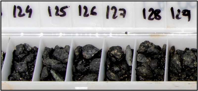RC drill chips from LAARC003 showing sulphide rich mineralisation