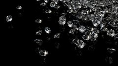 Diamonds on black background with space for text.